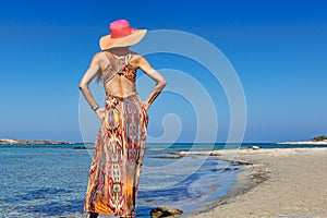 A woman at the beach Elafonisos of Creta, Greece photo