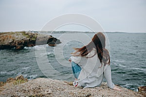 beautiful woman beach tourism cloudy weather stone coast unaltered