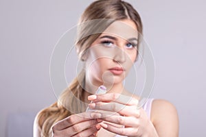 Beautiful Woman With Beauty Face Applying Lip Balsam, Lips Skin Care. Lipbalm On Sexy Lips