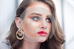 Beautiful Woman With Beauty Makeup On Face, Red Lipstick On Lips And Glamourous Look