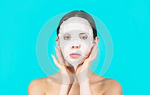 Beautiful woman with beauty mask. Skin care and beauty concept. Moisturizing mask. Anti aging procedure. Woman applying