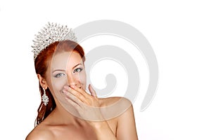 Beautiful woman, beauty queen with crown on head smile hand on face isolated white studio wall background