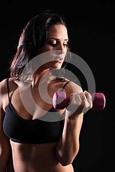 Beautiful woman bicep curl exercise in gym