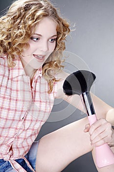 Beautiful woman with big brush