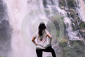 Beautiful woman at big waterfall after hiking in Chiang Mai & x28;Thailand