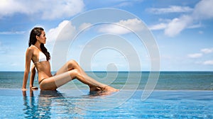 Beautiful woman in bikini sunbathing at the seaside