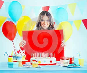 Beautiful woman with a birthday cake making silence gesture