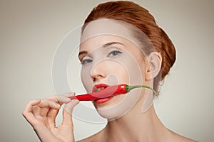 Beautiful Woman Biting Spicy RedChili P