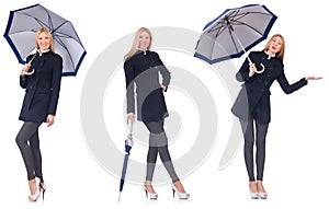 The beautiful woman in black coat with an umbrella