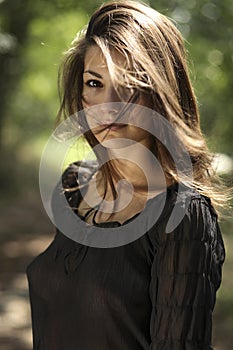 Beautiful woman with black shirt in the park