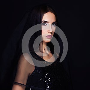 Beautiful woman with black veil