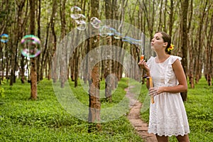 Beautiful woman blowing bubbles