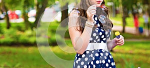 Beautiful woman blowing bubbles