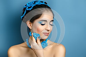 Beautiful woman with blue accessory