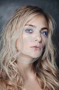 Beautiful woman with blue mascara