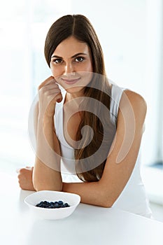 Beautiful Woman With Bowl Of Blueberries. Healthy Diet Nutrition