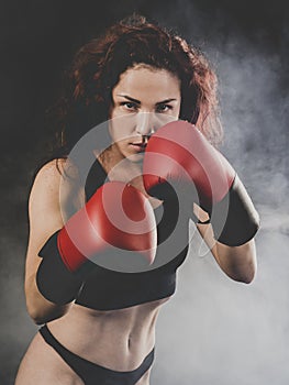 Beautiful woman boxer ready to fight