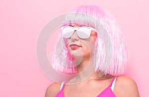 Beautiful woman in a bright pink wig