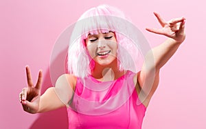 Beautiful woman in a bright pink wig