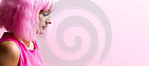 Beautiful woman in a bright pink wig