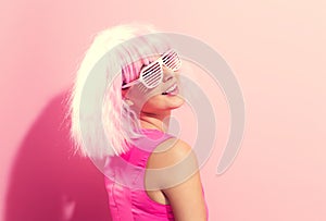 Beautiful woman in a bright pink wig