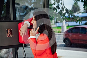 Beautiful asian woman brunette talking on the street phone