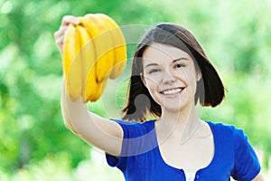 Beautiful woman bunch bananas hand