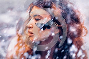 Beautiful young woman with butterfly. conceptual. double exposure