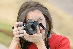 Beautiful woman with camera