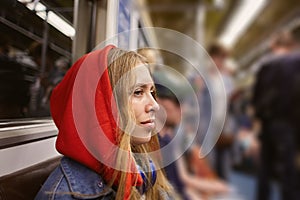 Beautiful woman in car of train in metro