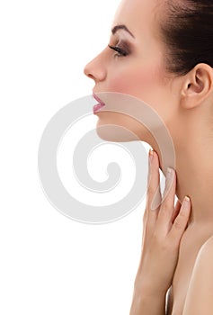 Beautiful woman cares for the skin neck