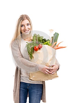 Beautiful woman carrying vegetables