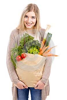 Beautiful woman carrying vegetables