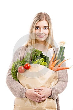 Beautiful woman carrying vegetables