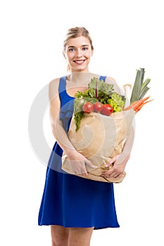 Beautiful woman carrying vegetables