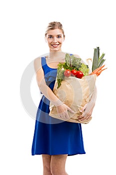 Beautiful woman carrying vegetables