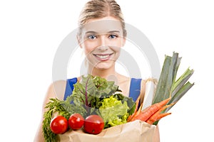 Beautiful woman carrying vegetables