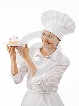 Beautiful woman chef cook showing a cake