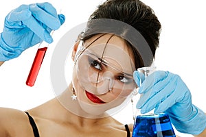 Beautiful woman with chemical glassware