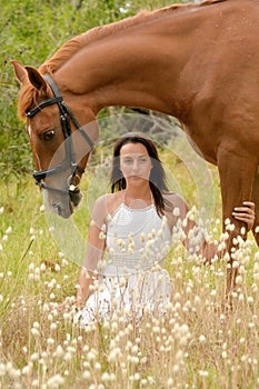 Beautiful woman with chestnut horse