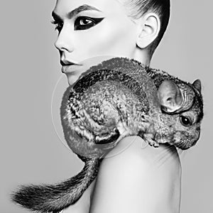 Beautiful woman with chinchilla