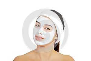 Beautiful woman with clay facial mask