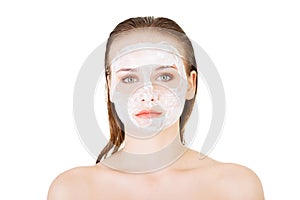 Beautiful woman with clay facial mask