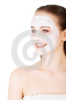 Beautiful woman with clay facial mask