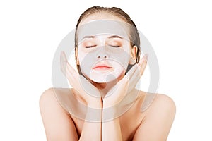 Beautiful woman with clay facial mask