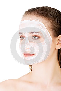 Beautiful woman with clay facial mask