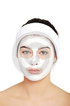 Beautiful woman with clay facial mask