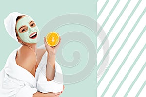 Beautiful woman with clay mask on pastel green background. Beauty and spa