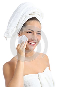 Beautiful woman cleaning her face with a baby wipe