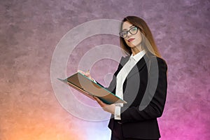 Beautiful woman with clipboard offering sign a contract with pen